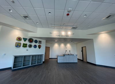 Newly rehabilitated interior of headquarters building with wood floors and white walls.