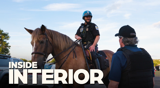 Park police on mounted patrol next to Secretary Burgum