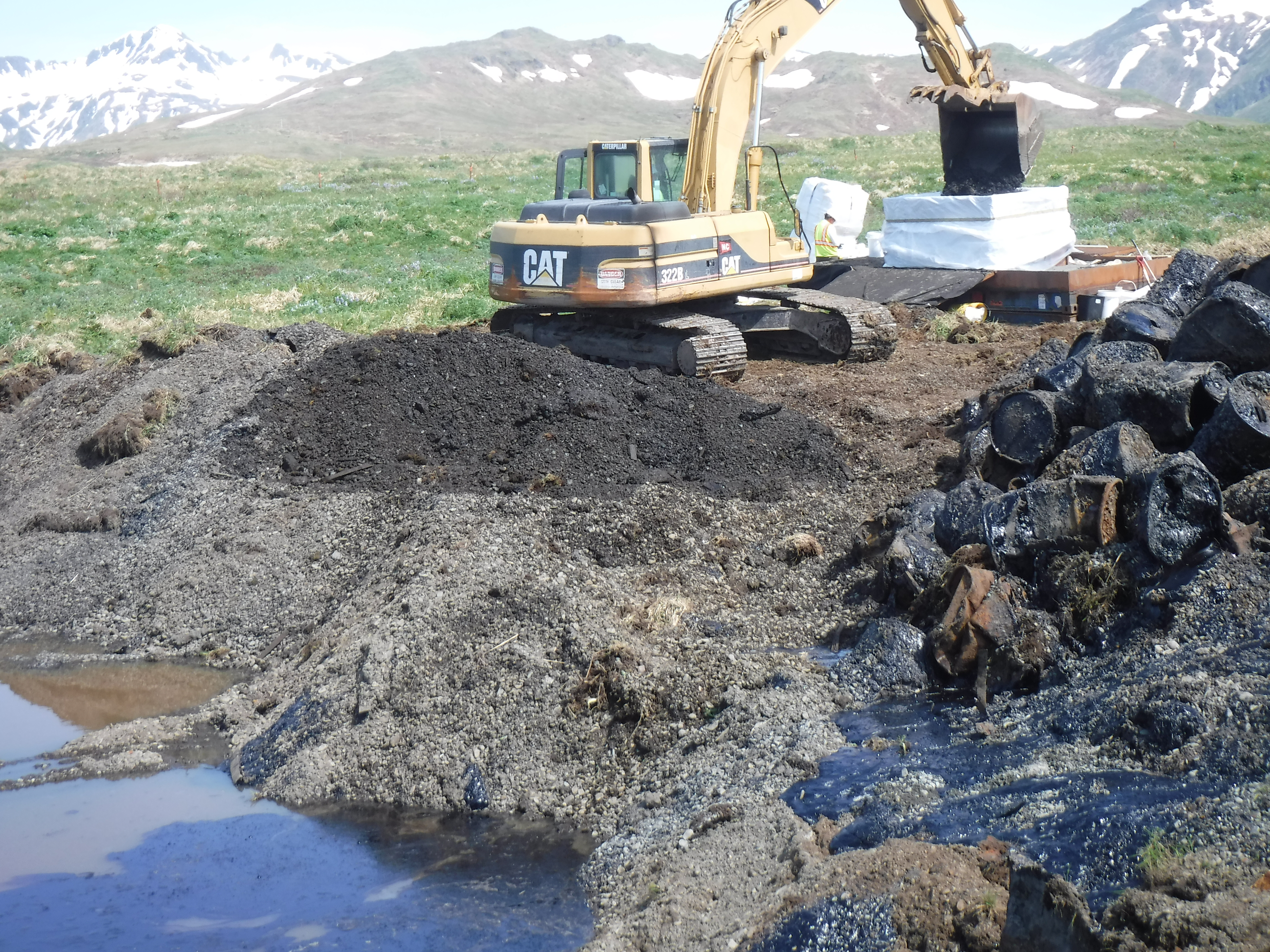 Drum removal from contaminated FUDS site on Attu Island.