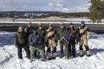 Yellowstone staff with Sec Doug Burgum holding 250 flag