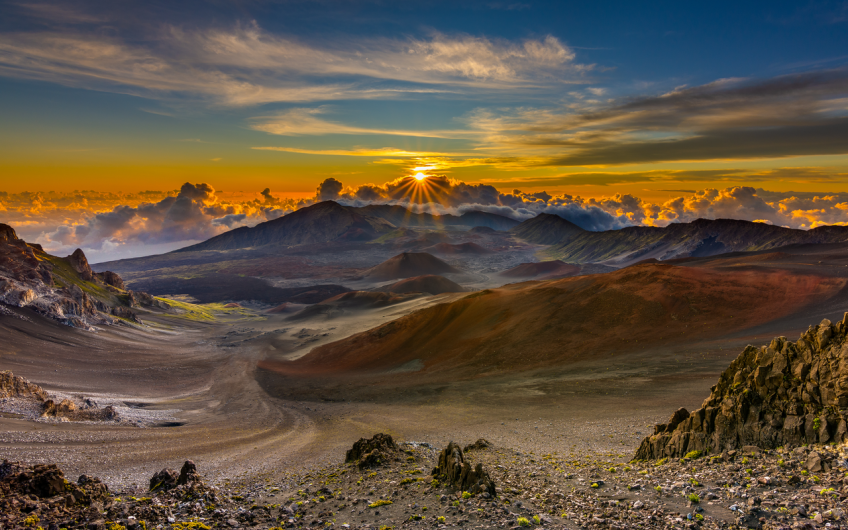 Sunrise at Haleakala highlights the rugged landscape.