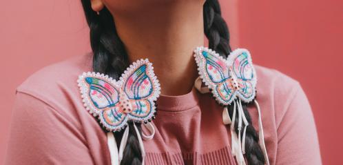 Photograph of beaded butterfly braid ties. 
