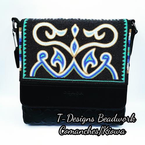 Beaded Purse by Tessa Robledo Image of a black purse with an embroidered beaded design.