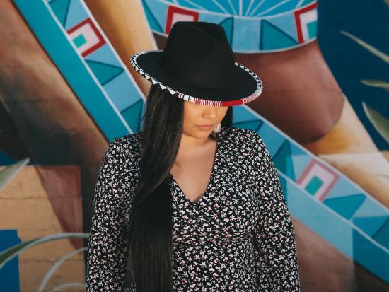 Black hat with beaded rim by Amanda O'Connell. 