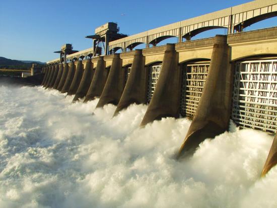 Large dam with fast moving white water. 