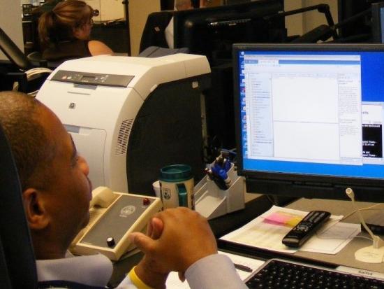 A man looks at data on a computer