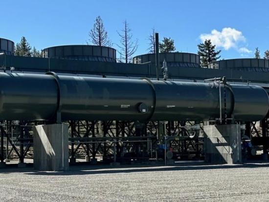 Large tank and machinery on a platform.