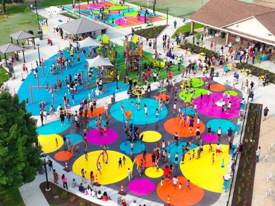 Public park with bright colored circles on the ground.