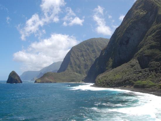 Rugged cliffs alongside shoreline.