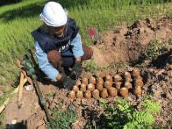 Man clearing mines