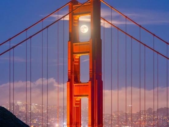 Golden Gate Bridge with moon in background