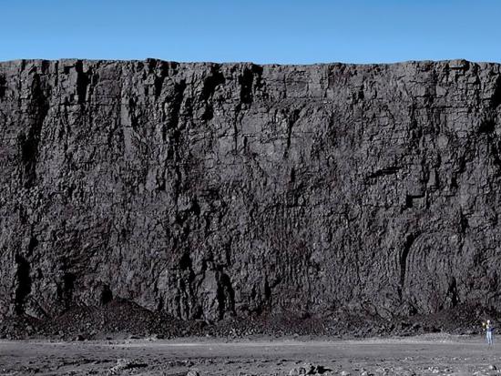 Tall ridge of grey colored rock.