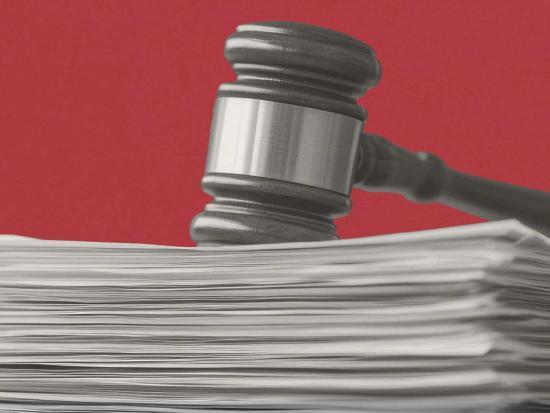 Gavel on a stack of papers