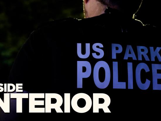 US Park Police is seen on the back of an officer's vest