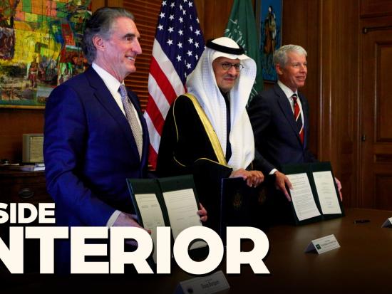 Secretary Burgum and Dignitaries stand with signed documents