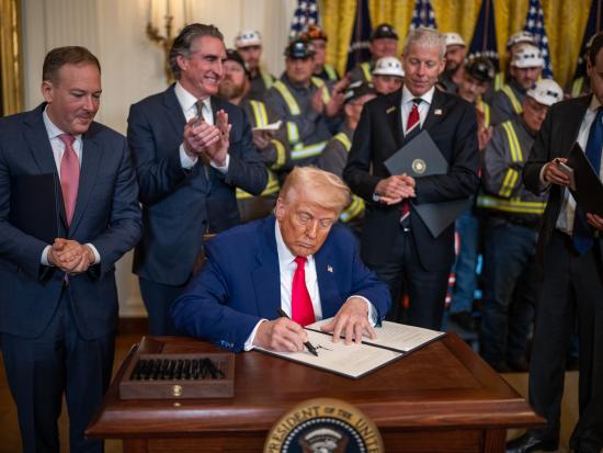 President Trump signing EO with Secretary Burgum clapping in background