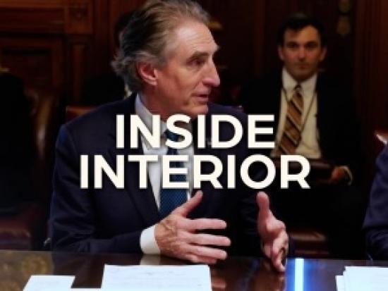 Secretary Burgum in a formal meeting setting