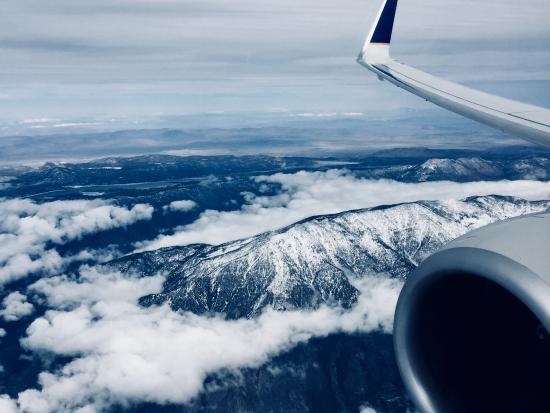 View of mountains out the window of an airplane