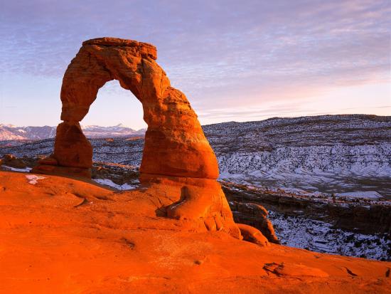 Delicate Arch, sometimes unofficially called "License Plate Arch," is a spectacular place to watch the sunset in Arches National Park, Utah. 