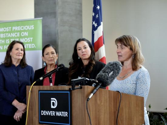 ASWS Tanya Trujillo speaking at the press conference  (from left) is Congresswoman Diana DeGette of Colorado, Secretary Haaland, and Becky Mitchell, Director of the Colorado Water Conservation Board