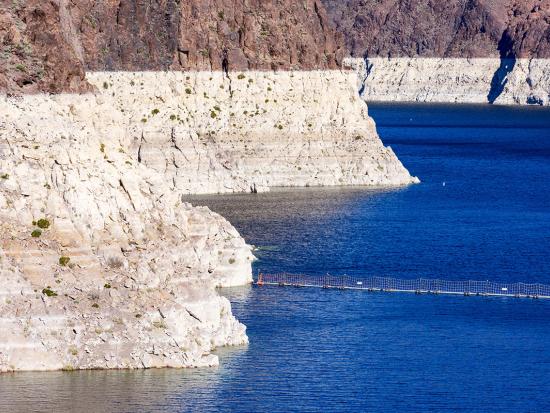 Blue water in Lake Mead with rugged shoreline