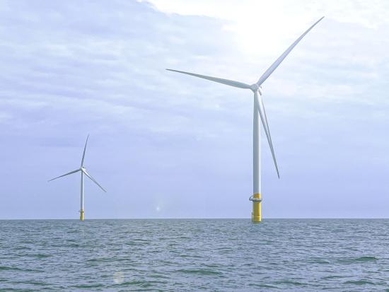 Two wind turbines in the ocean