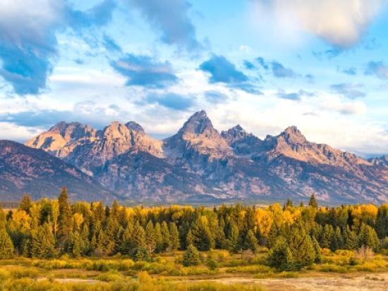 Jagged mountain range with prairie in front