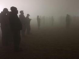 Firefighters receive a briefing amid the smoke from the 2020 Holiday Fire in Oregon. Photo by Megan McGinnis, BLM.