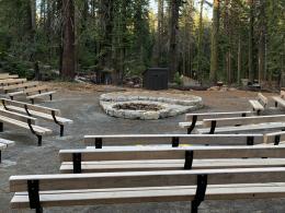 Stone outdoor amphitheater with wooden benches