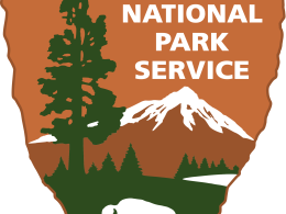 Orange badge with "National Park Service" written in white lettering