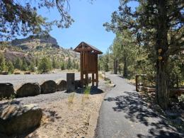 A kiosk at a campground in a scenic outdoor setting.