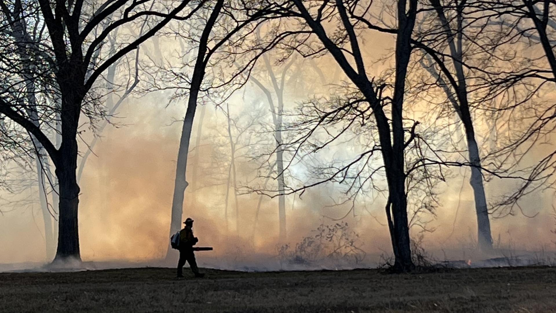 A wildland firefighter conducts prescribed burn work on Chickasaw Nation lands. Photo by Josh Williams